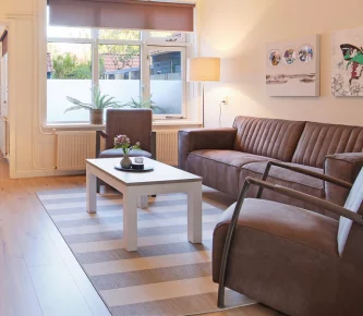 A cozy living room with a comfy couch and a stylish coffee table