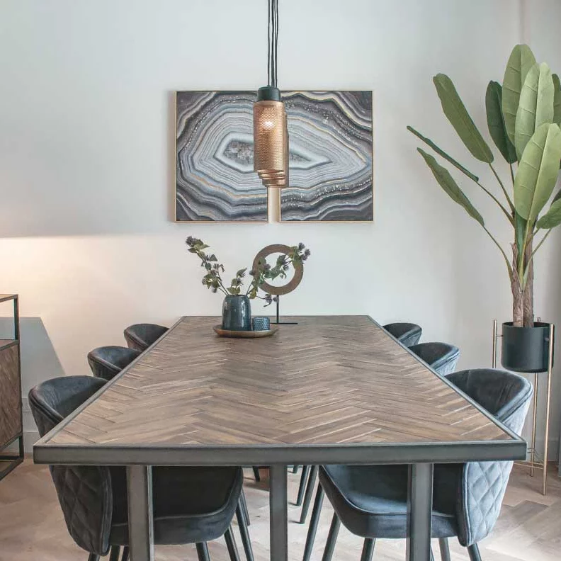 Dining table with hanging lamp and artwork on the wall