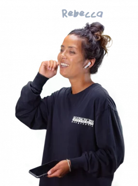 Mylène wearing a headset and smiling