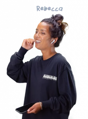 Mylène wearing a headset and smiling