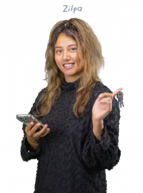 Zilpa holding a phone and keys