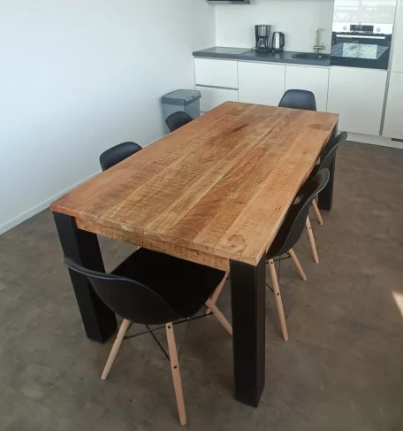 A wooden table with chairs in the kitchen