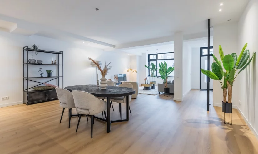 Set dining table with grey chairs and black hanging lamp